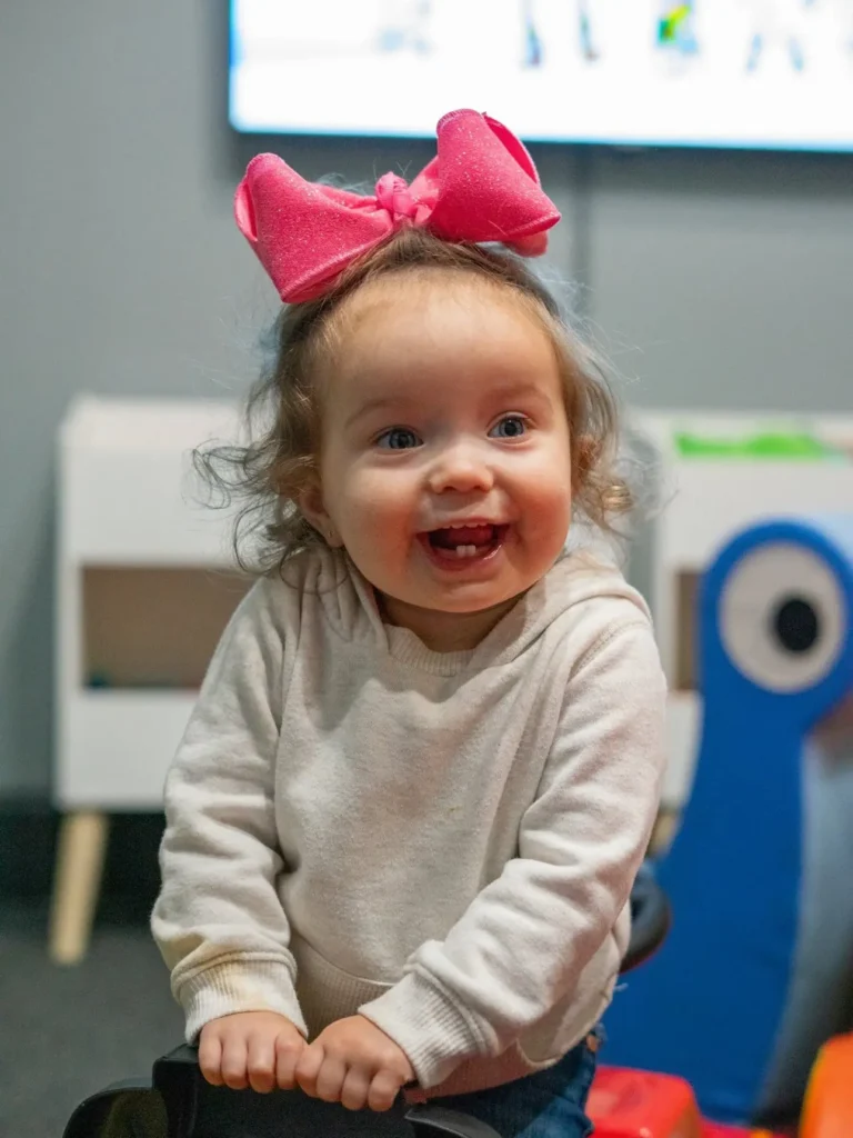 ngKid smiling at the camera.