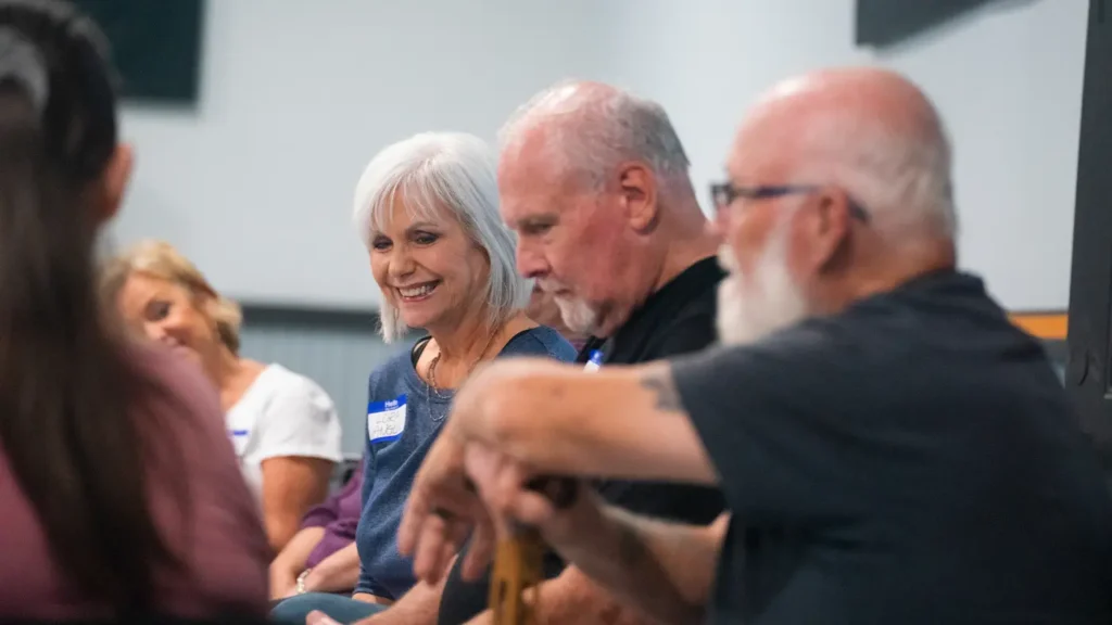 Woman from ngLegacy smiling and laughing.