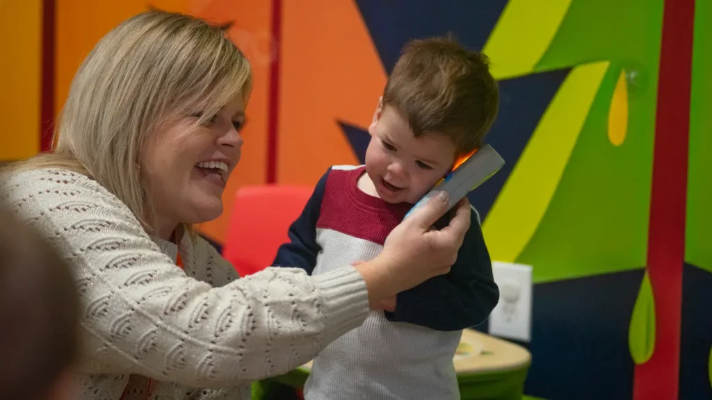ngKids volunteer and child playing.